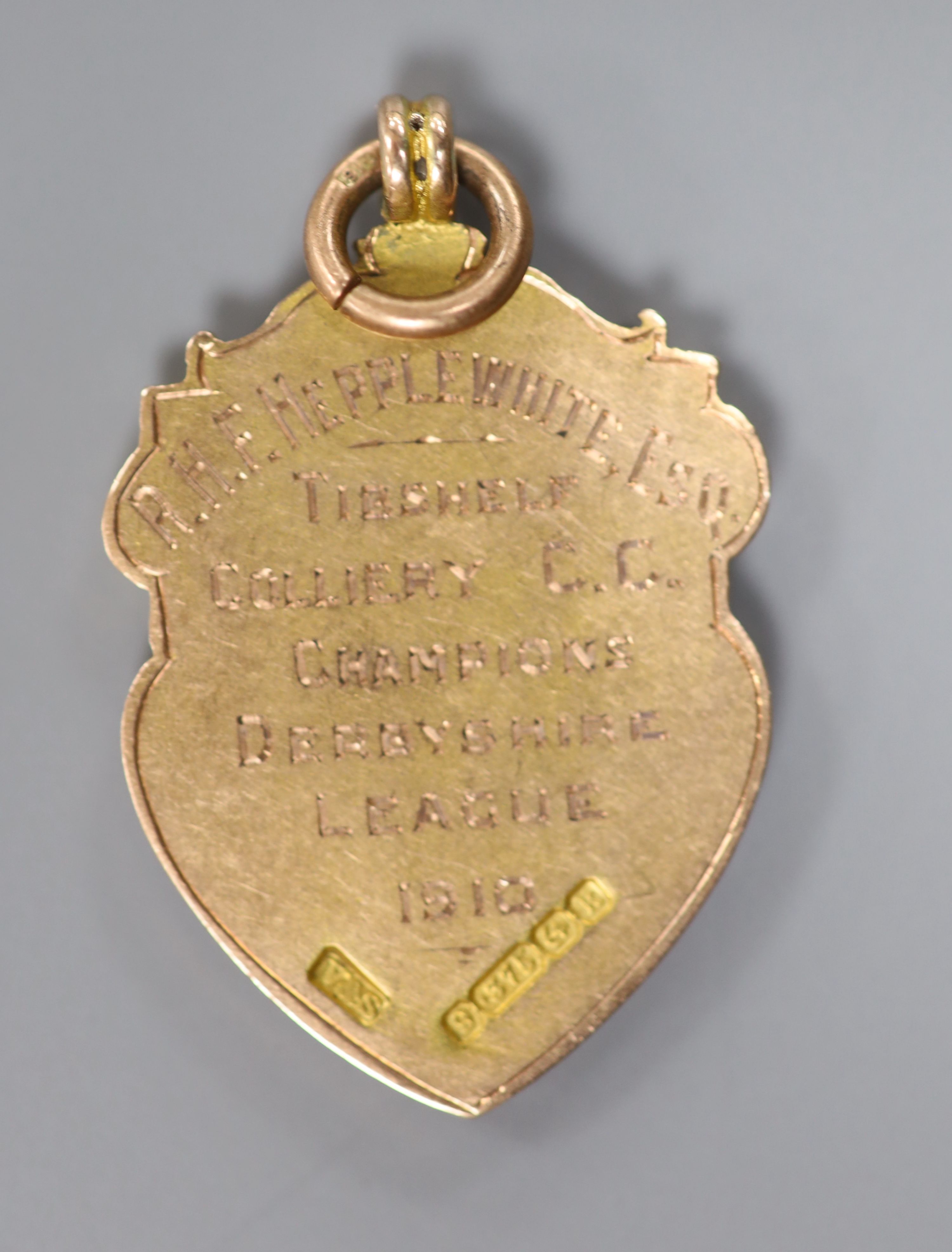An Edwardian Derbyshire League 9ct gold and enamel cricket medal, Vaughton & Sons, Birmingham, 1909,